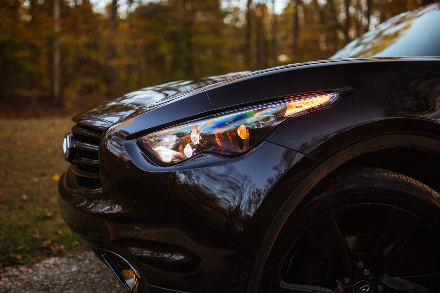 EVO TRI headlight on a black QX70 from a low front angle