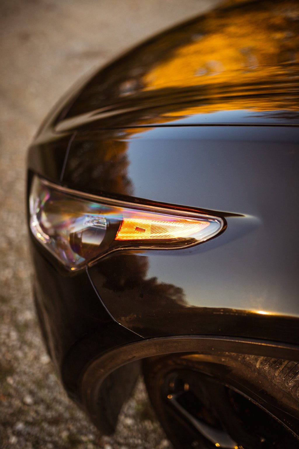 Side profile of the EVO TRI headlight on a QX70 fender