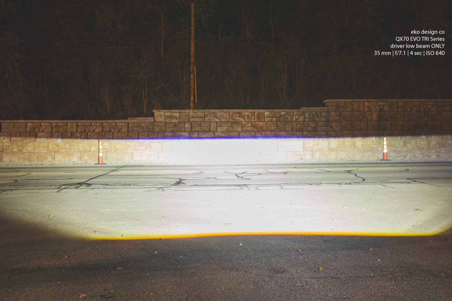 Wall shot of the beam from one EVO TRI headlight on low beam, a wide white pattern with a flat cutoff