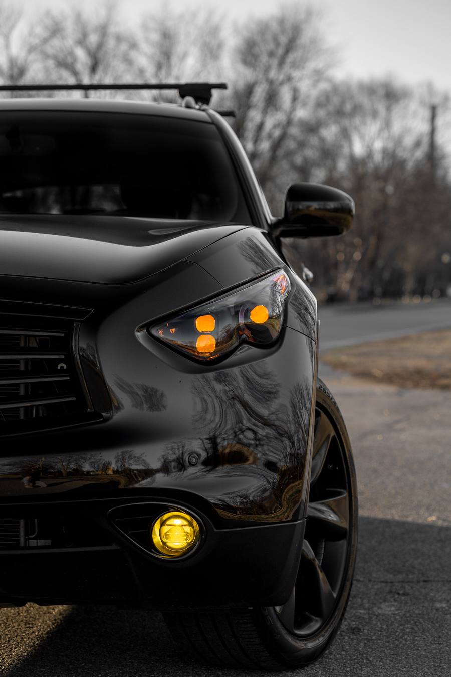 QX70 front corner with the EVO TRI amber DRLs and amber fog light on